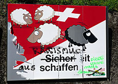 Swiss poster showing 3 white sheep kicking a black sheep out